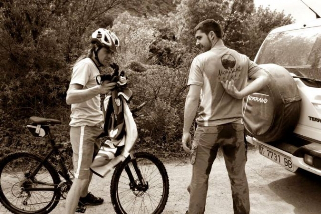  cyclist and instructor next to a 4x4 